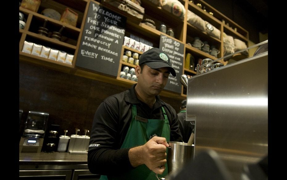 An employee brewing coffee at the 4000 sq ft Horniman Circle store. The location ranks among the lar