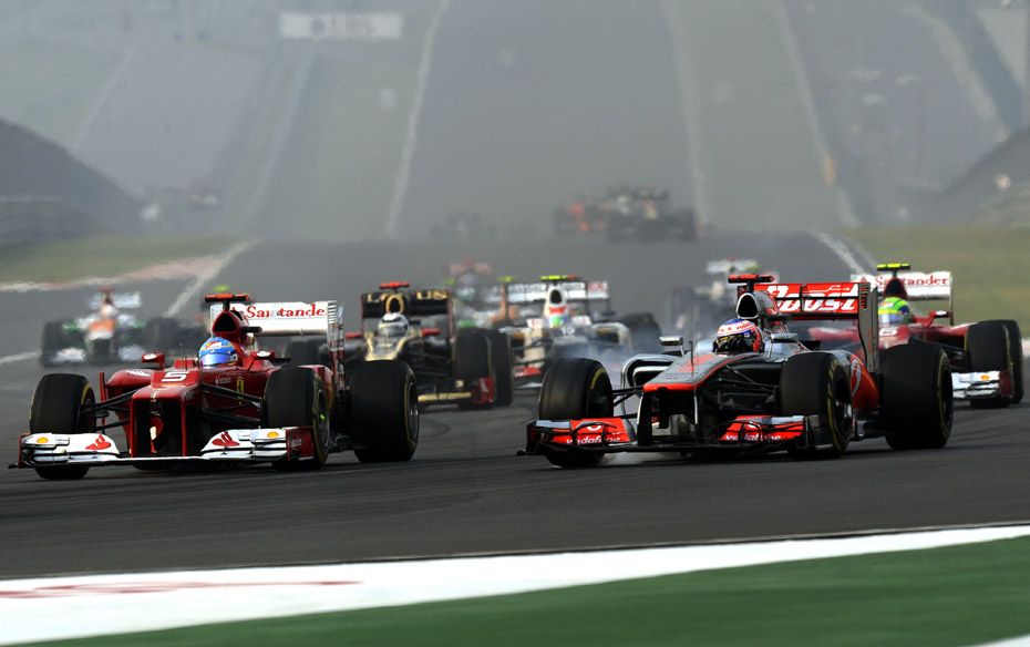  Fernando Alonso (ESP) of Ferrari F2012 alongside Jenson Button (GBR) McLaren. The Spaniard bro