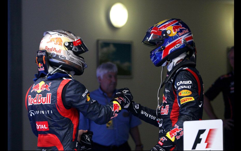 Vettel celebrates with his teammate Mark Webber, who fiinished third on the podium                  