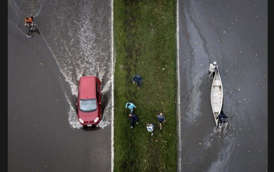 An aerial view of a boat and a car on a flooded street after heavy rains lashed the eastern Argentin