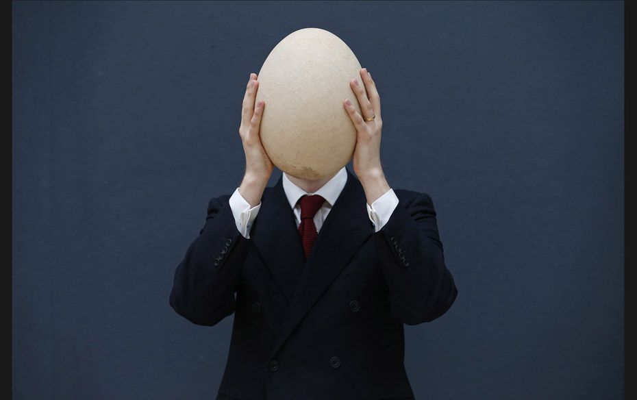 Christie’s specialist James Hyslop holds a pre-17th century sub-fossilised Elephant Bird egg i