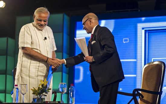 Narendra Modi being congratulated by Raghav Bahl after Modi's inaugural address at the ThinkIndi