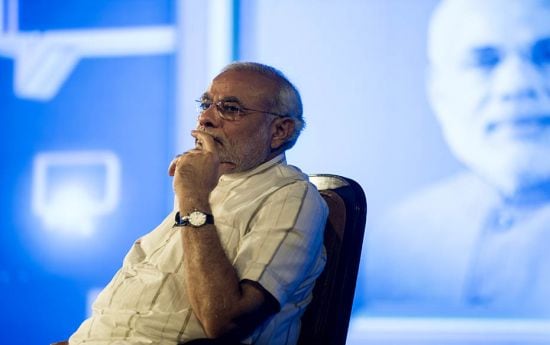 Narendra Modi listens attentively to a question from the audience after completing his address      