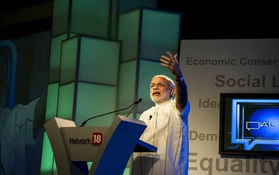 Narendra Modi delivering his keynote address on "Why India needs less government and more gover