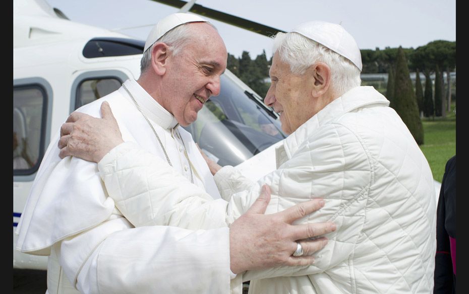 Pope Francis (L) embraces Pope Emeritus Benedict XVI as he arrives at the Castel Gandolfo summer res