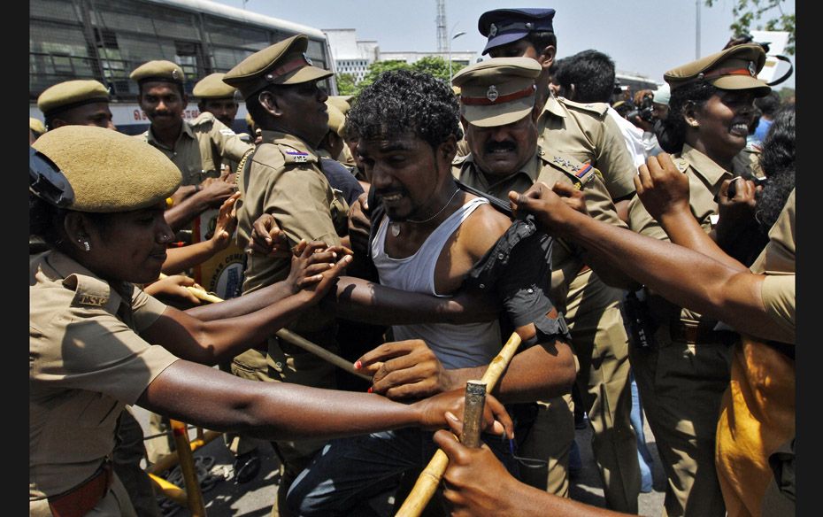 Police detain a college student during a protest in the southern Indian city of Chennai on March 27.