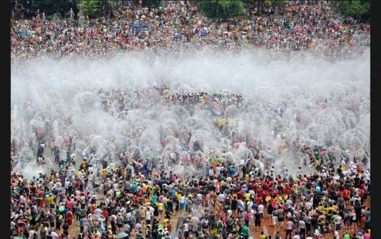 People participate in the annual Water Splashing Festival to mark the traditional New Year of the Da