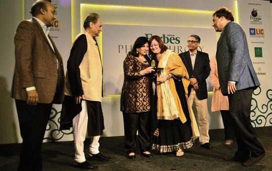 Members of the Bajaj family receiving the Distinguished Family of the Year award for outstanding wor