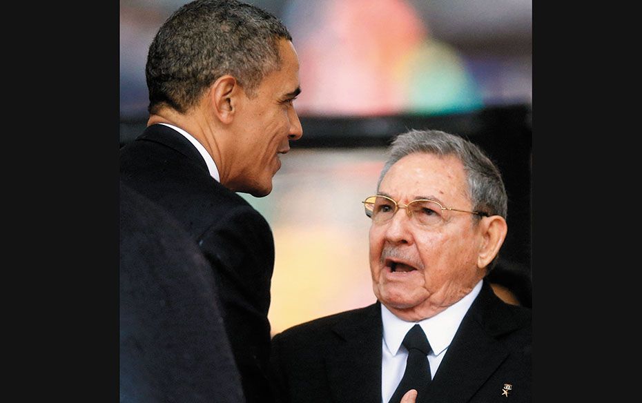 US President Barack Obama (left) greets his Cuban counterpart Raul Castro before his speech at the m