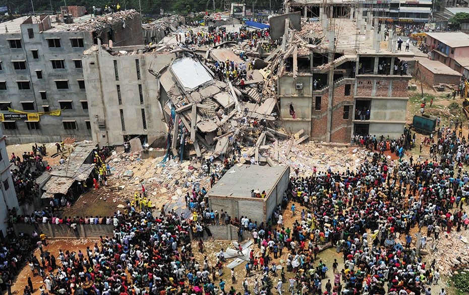 Volunteers carry out rescue operations after an eight-storied building housing garment factories col