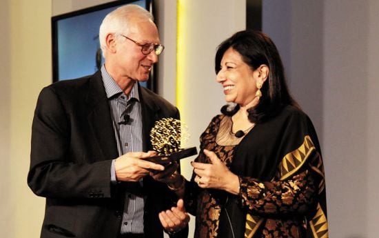 Kiran Mazumdar-Shaw presenting Jamshyd Godrej, chairman, Godrej and Boyce, with the Outstanding Corp