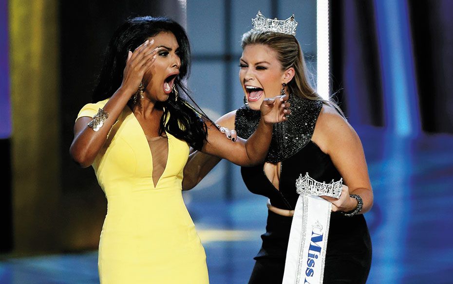 Miss New York Nina Davuluri (left) reacts after being chosen the first Indian-American winner of the