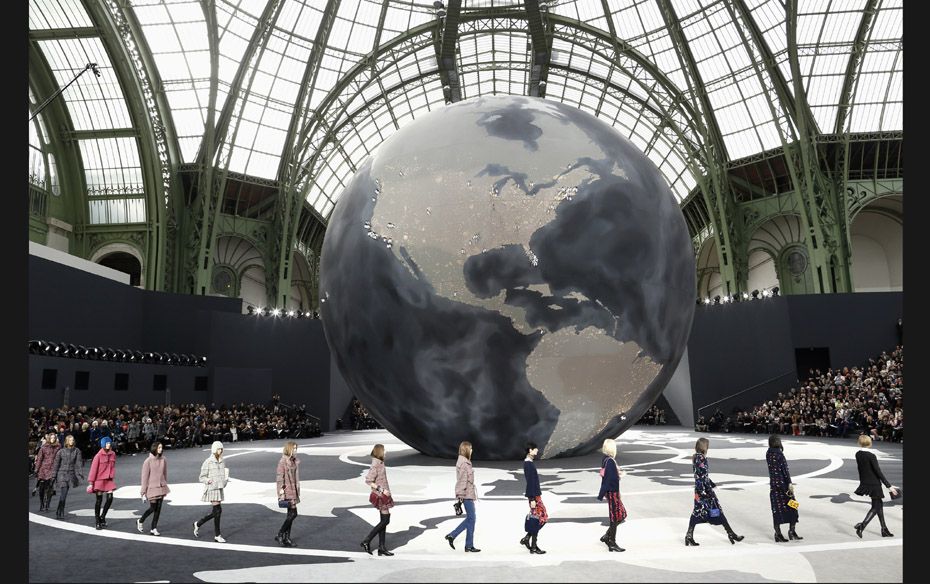 Models present creations by German designer Karl Lagerfeld for French fashion house Chanel as a part