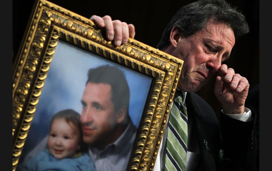 Neil Heslin, father of six-year-old Jesse Lewis (Sandy Hook Elementary School shooting victim), hold