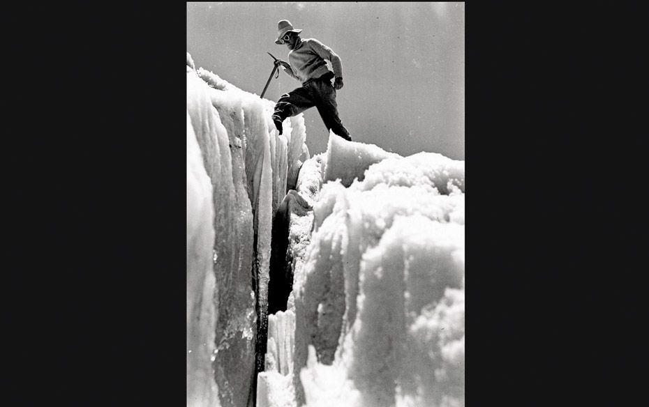 A member of a 1936 expedition tries to cross a crevasse                                             