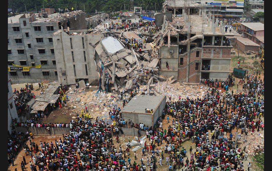 Bangladeshi volunteers and rescue workers are pictured at the scene after an eight-storey building c