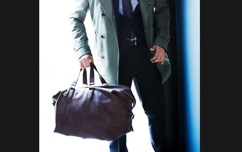 Sherborne Grip Bag ($1,975) by Alfred Dunhill; trench coat ($945) by Hugo Boss; wool suit ($1,295), 