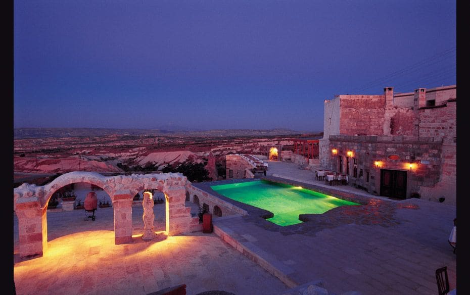 TURKEY Evening light on the patio and pool of Museum Hotel in Cappadocia                        