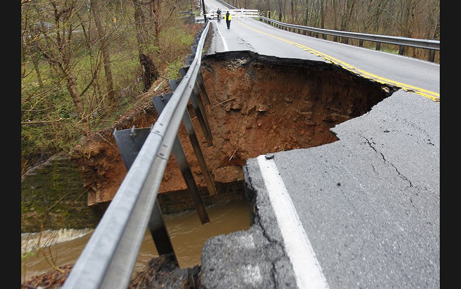 Louisville Metro Police block Highway 22 after the road collapsed in Louisville, Kentucky on April 3