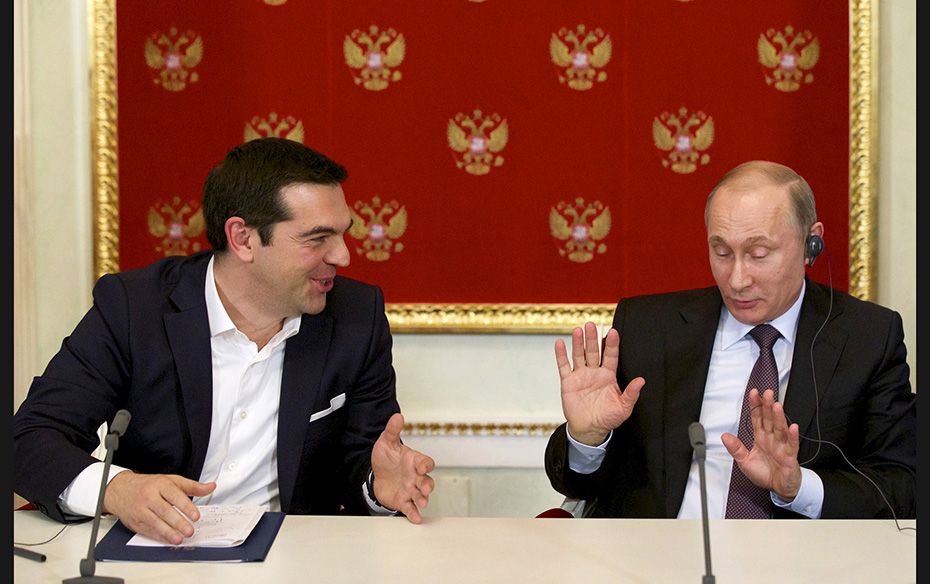 Russian President Vladimir Putin (R) and Greek Prime Minister Alexis Tsipras attend a signing ceremo