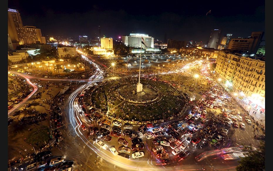 People gather at Tahrir Square to celebrate the opening of the New Suez Canal in Cairo, Egypt, on Au