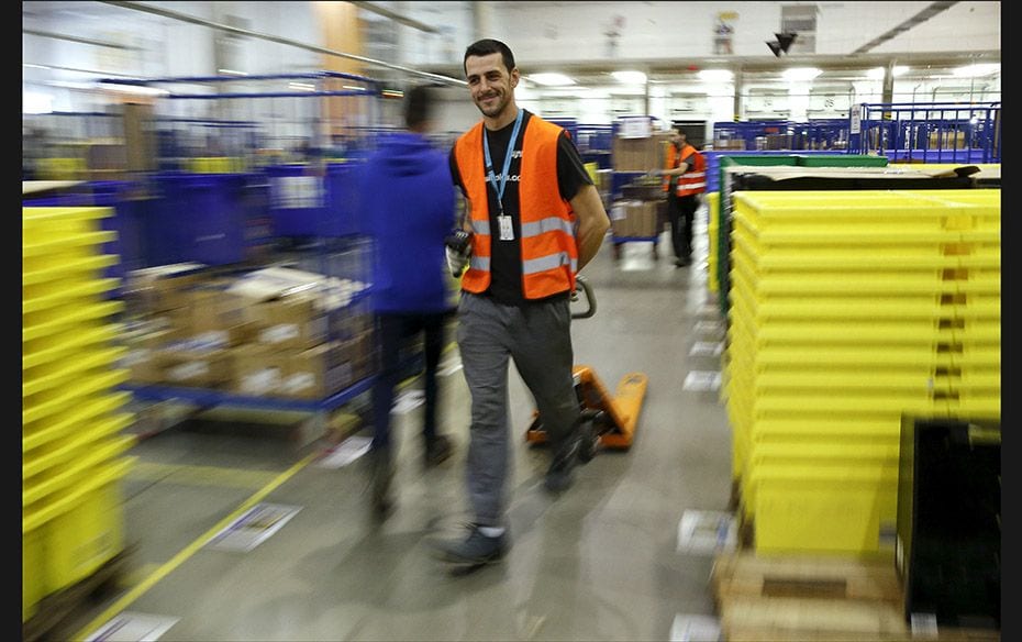 People work during the Black Friday deals week at an Amazon fulfillment centre in Madrid, Spain on N