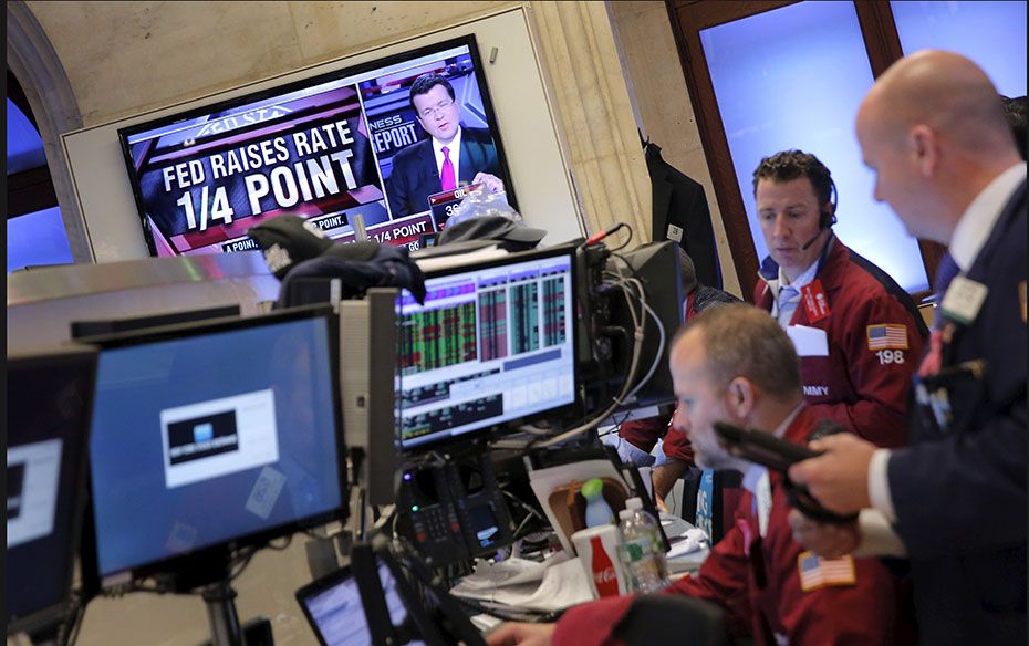 Traders work on the floor of the New York Stock Exchange (NYSE) shortly after the announcement that 