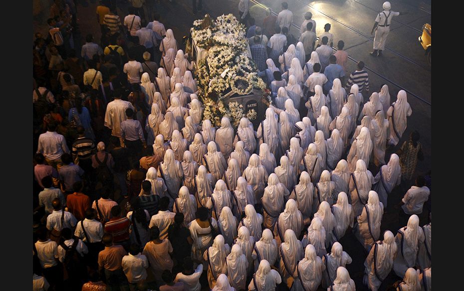 Nuns from the Missionaries of Charity, the global order of nuns founded by Mother Teresa, pay their 