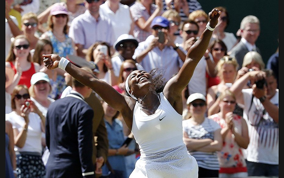 Serena Williams of the US celebrates after winning the Wimbledon women’s singles final by defe