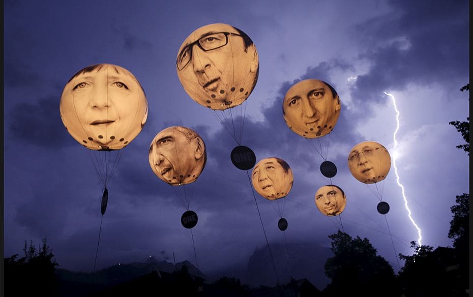 Lightning strikes the Alpine mountains over Garmisch-Partenkirchen as balloons, made by the ‘O