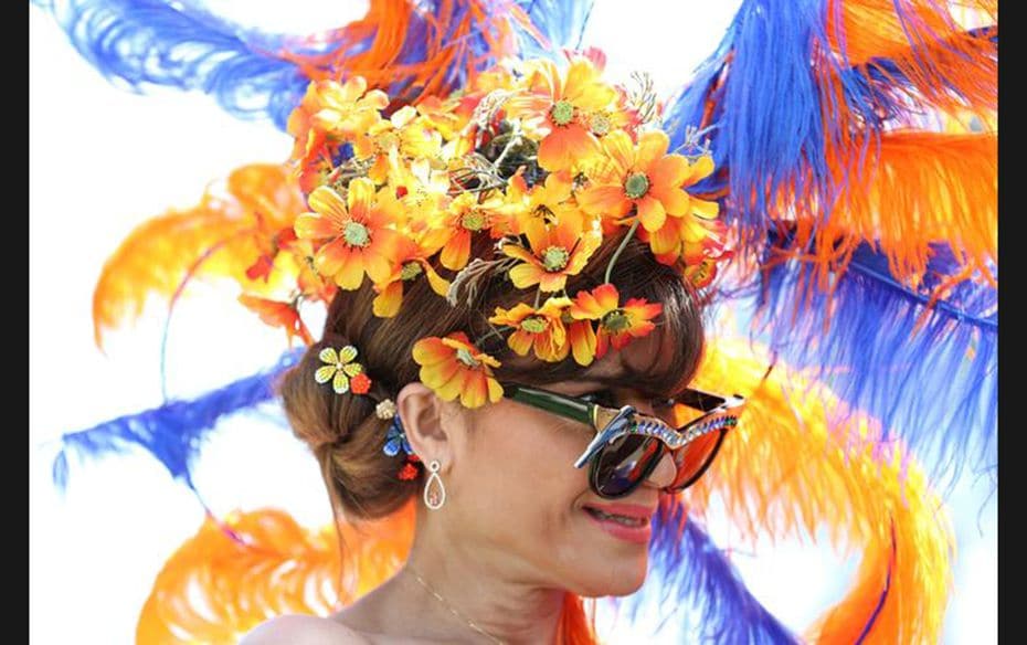 A race-goer poses as she arrives at the Royal Ascot horse racing festival, in Ascot, England on June