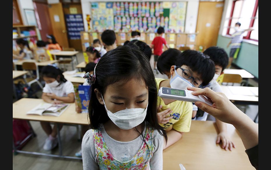 An elementary school student wearing a mask to prevent contracting Middle East Respiratory Syndrome 