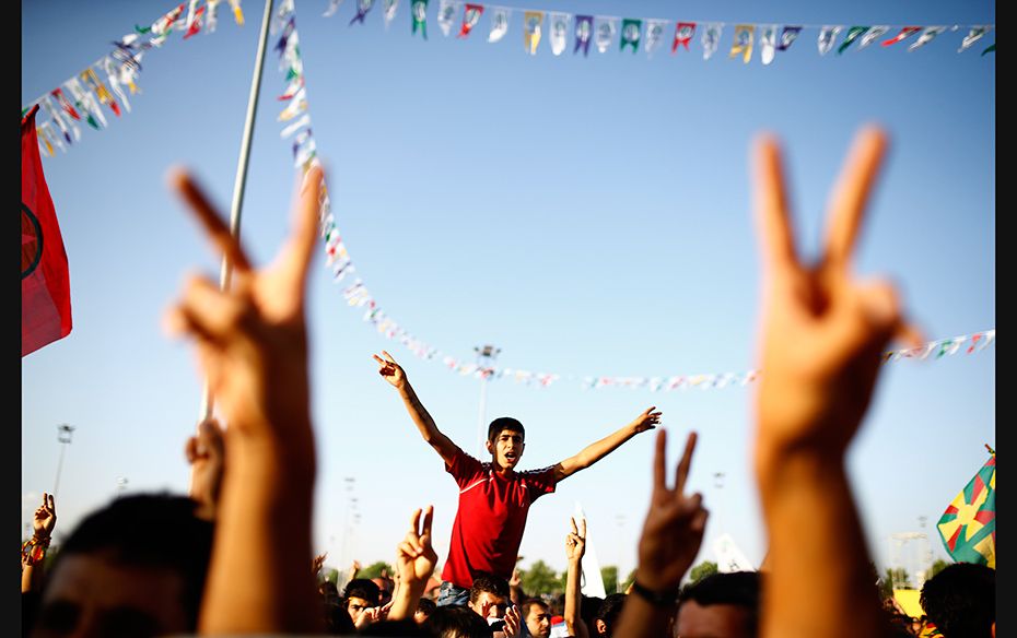 Supporters of the Pro-Kurdish Peoples' Democratic Party (HDP) cheer during a gathering to celebr