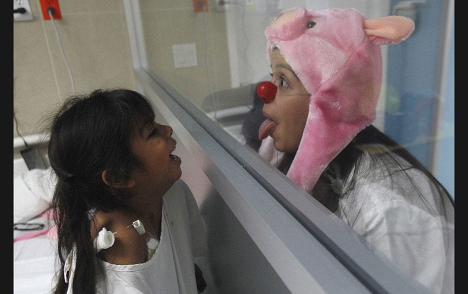 A member of 'Laughter Doctors of Ciudad Juarez' performs at a children's hospital in Ciu