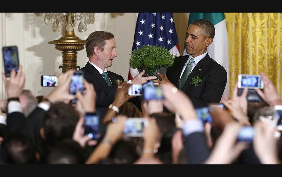 Ireland's Prime Minister Enda Kenny (left) presents a bowl of shamrocks to US President Barack O