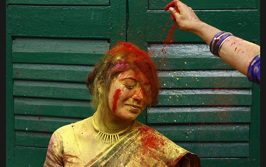 A student of Rabindra Bharati University during Holi celebrations in Kolkata on March 2. Holi, also 