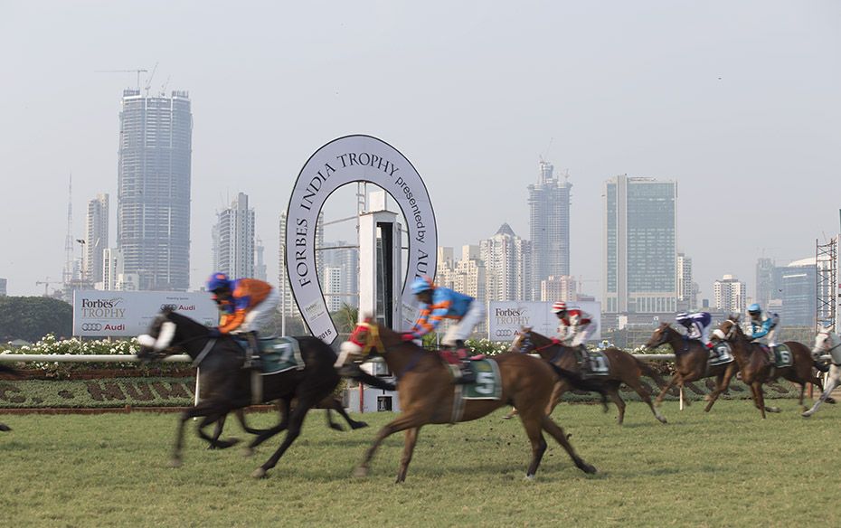 The evolving central Mumbai skyline towers over the Turf Club, an oasis of greenery                 