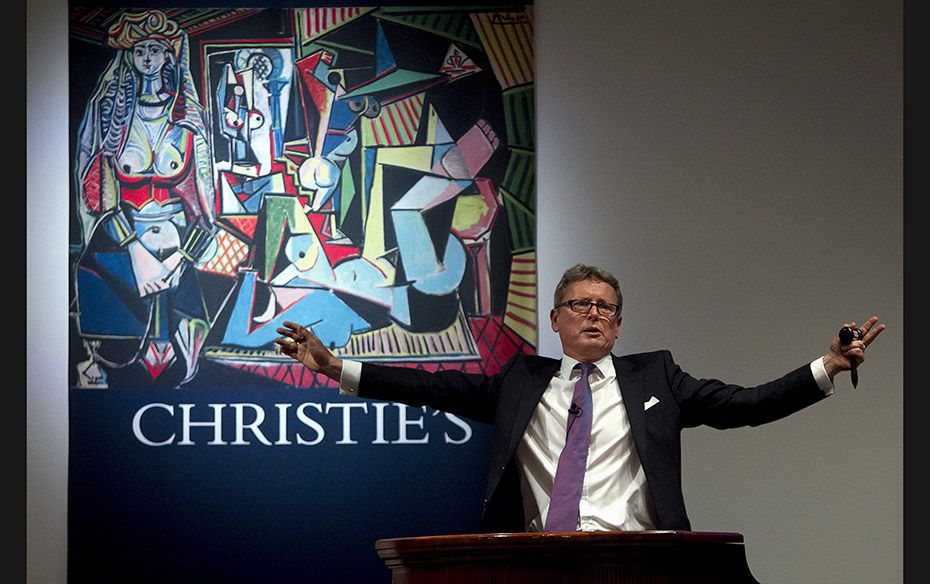 Auctioneer Jussi Pylkkanen calls for final bids before dropping the gavel as he sells Pablo Picasso&