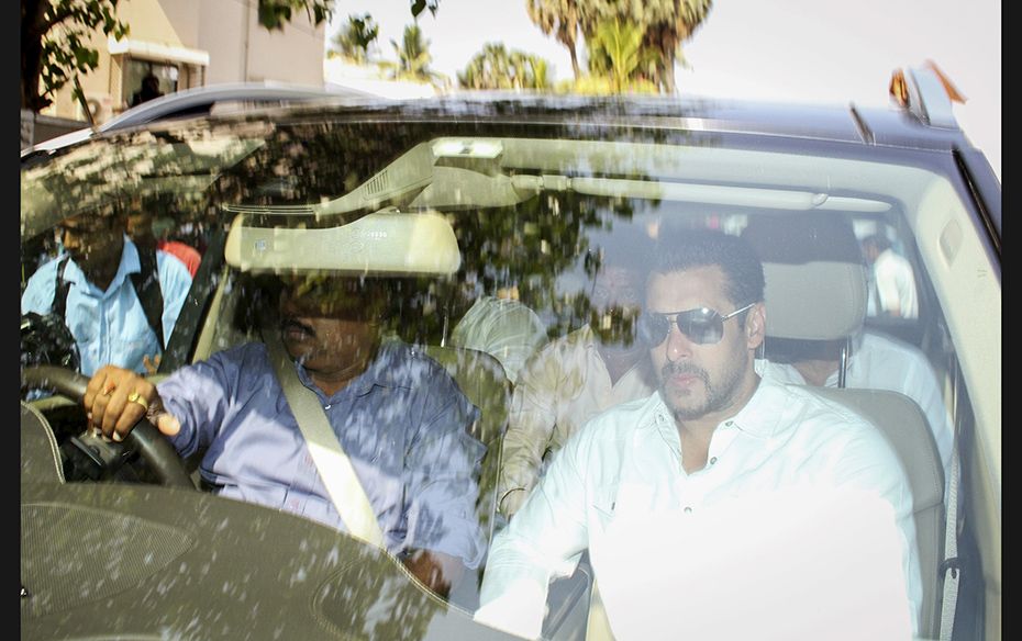 Bollywood actor Salman Khan (right) leaves his house for the court in Mumbai on May 6, 2015. He was 