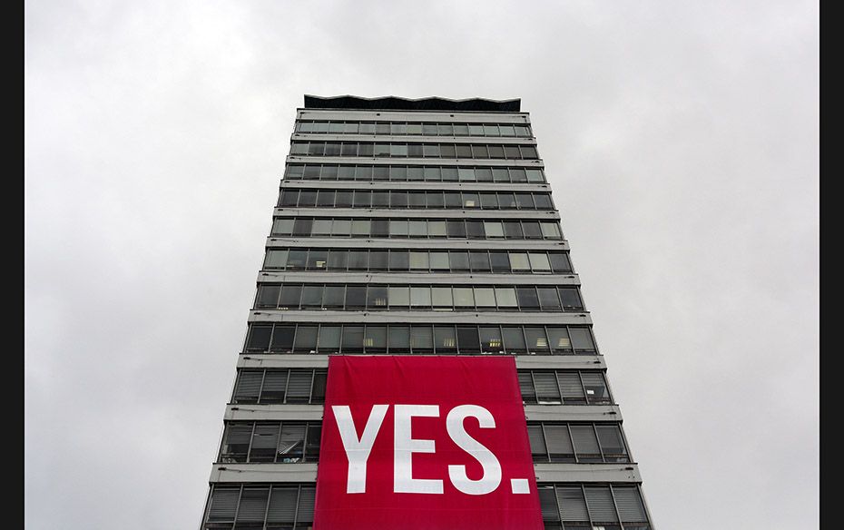 A large banner supporting a ‘Yes’ vote to legalise same sex marriage hangs from a buildi