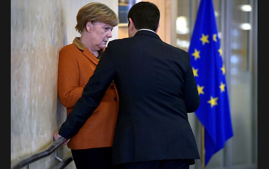 Greek Prime Minister Alexis Tsipras (right) chats with German Chancellor Angela Merkel before a cent