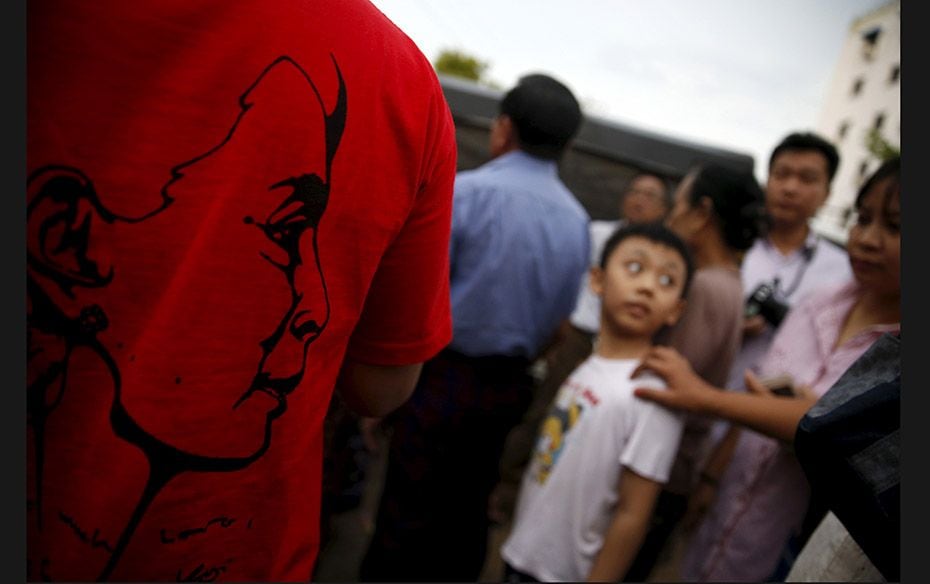 Supporters of Myanmar leader Aung San Suu Kyi eagerly wait for the election results outside the Nati