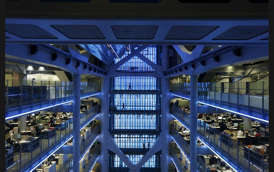 Employees walk on the sidewalks inside the HSBC headquarters in Hong Kong on November 3. HSBC is see