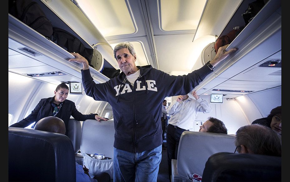 US Secretary of State John Kerry speaks to the media aboard his plane before he heads back to the US