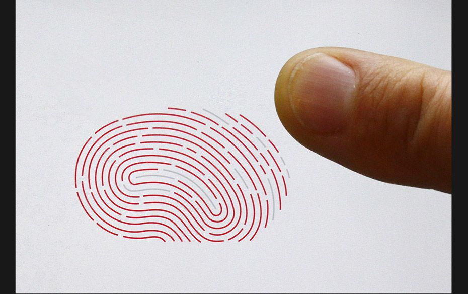 A person uses a sensor for biometric identification on a smartphone in Berlin, Germany on October 16