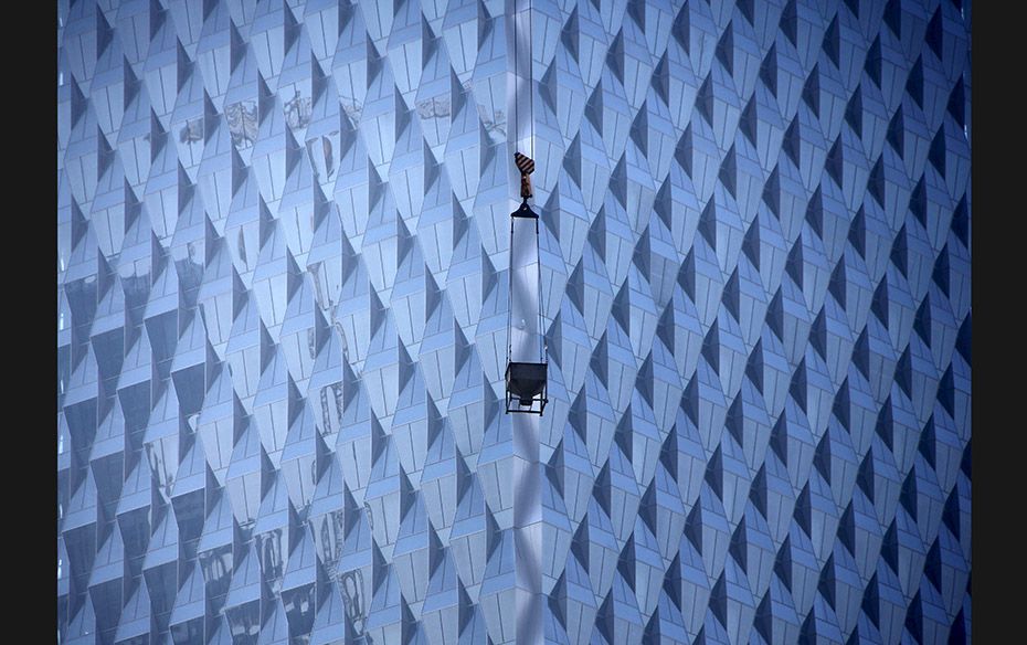 A crane is seen at a construction site for a new commercial building in Beijing, China on October 15