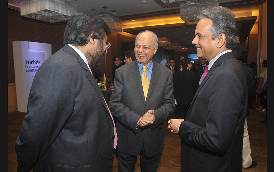 Harsh Goenka, chairman of RPG Enterprises (left) exchanges pleasantries with Ranjit Shahani, vice ch