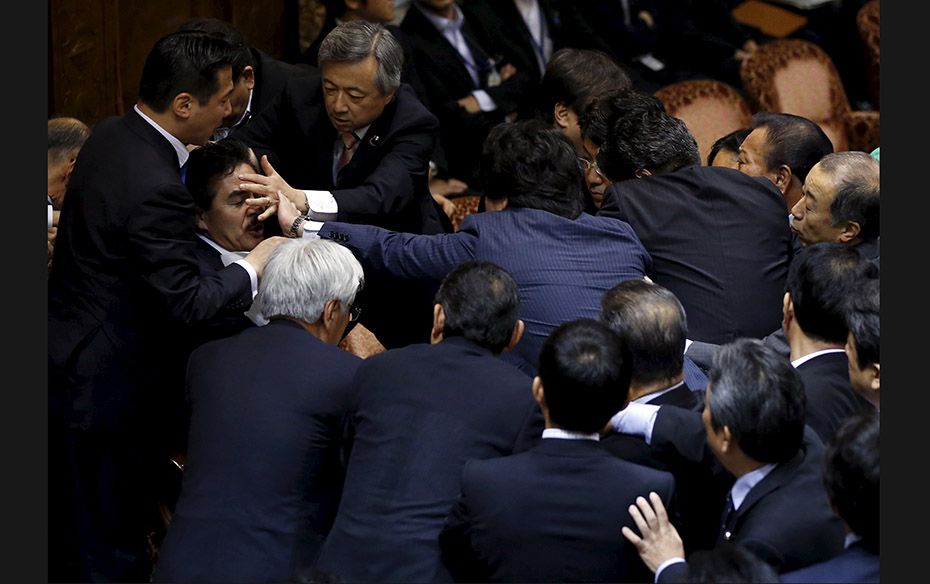 Opposition lawmakers crowd around Masahisa Sato (2nd L), deputation chairman of the upper house spec