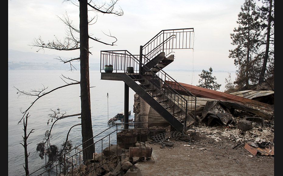 The remains of a waterfront home on Lake Chelan destroyed by the Chelan Complex fire in Washington o