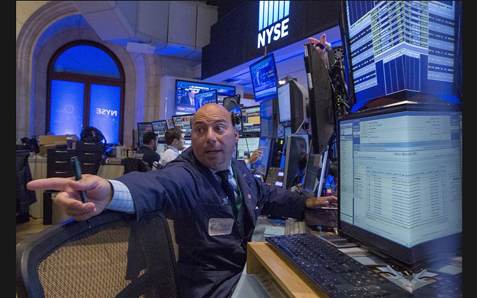 Traders work on the floor of the New York Stock Exchange on August 24, 2015. After weeks of turmoil 